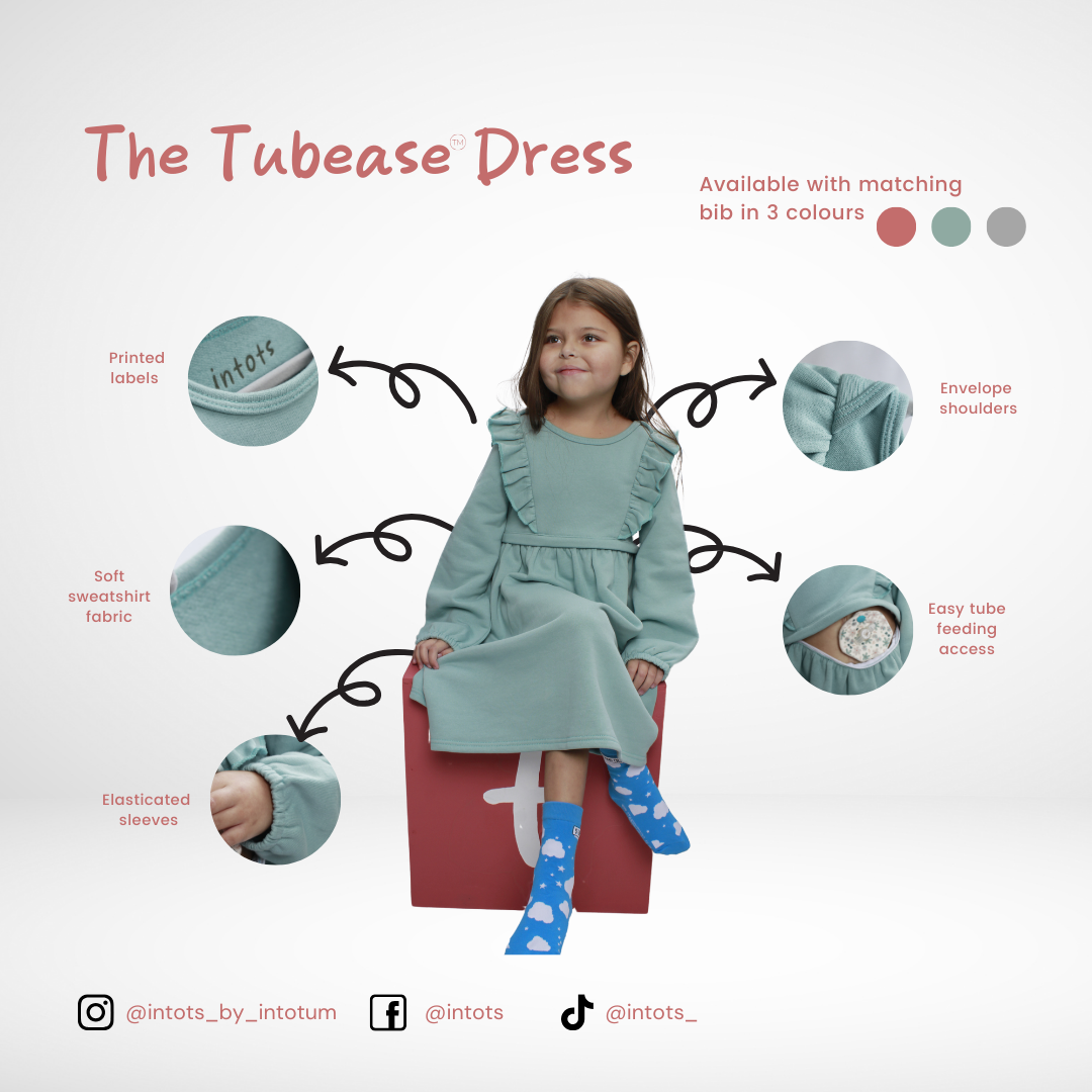Tube fed, disability, tube feeding, adaptive clothing, Stoma, wheelchair, GTube, Tubie, bibs, dribble bibs, neckerchief bibs, tube alimenté, handicapé, alimentation par sonde, vêtements adaptables, stomate, fauteuil roulant, Schlauchgespeist, Behinderung, Sondenernährung, Anpassungsfähige Kleidung, Stoma, Rollstuhl, Buisvoeding, handicap, sondevoeding, adaptieve kleding, Stoma, rolstoel, Sondeernæring, handicap, Sondeernæring, adaptivt tøj, Stomi, kørestol, karmienie przez rurkę, niepełnosprawność, karmieni