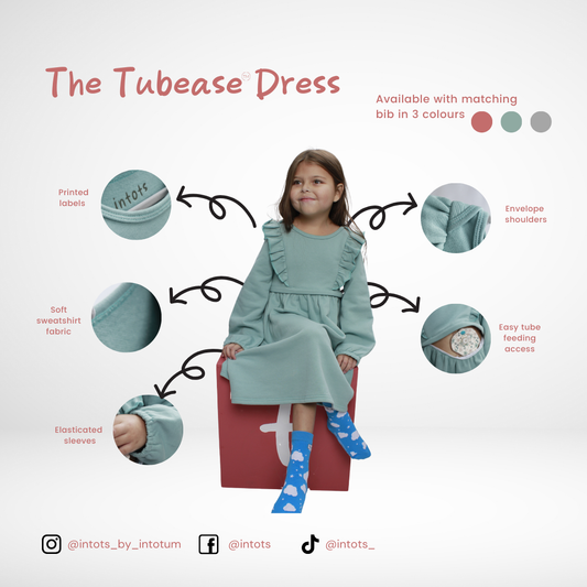 Tube fed, disability, tube feeding, adaptive clothing, Stoma, wheelchair, GTube, Tubie, bibs, dribble bibs, neckerchief bibs, tube alimenté, handicapé, alimentation par sonde, vêtements adaptables, stomate, fauteuil roulant, Schlauchgespeist, Behinderung, Sondenernährung, Anpassungsfähige Kleidung, Stoma, Rollstuhl, Buisvoeding, handicap, sondevoeding, adaptieve kleding, Stoma, rolstoel, Sondeernæring, handicap, Sondeernæring, adaptivt tøj, Stomi, kørestol, karmienie przez rurkę, niepełnosprawność, karmieni