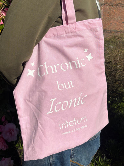 a person holding a pink bag