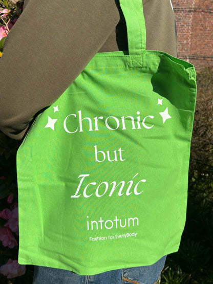 a person holding a green bag