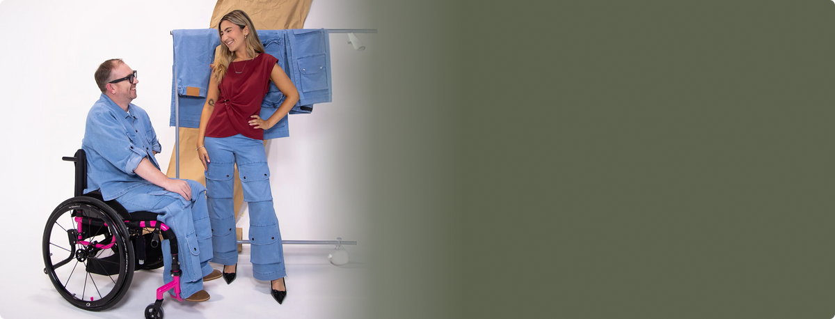 a woman standing in front of a clothing rack
