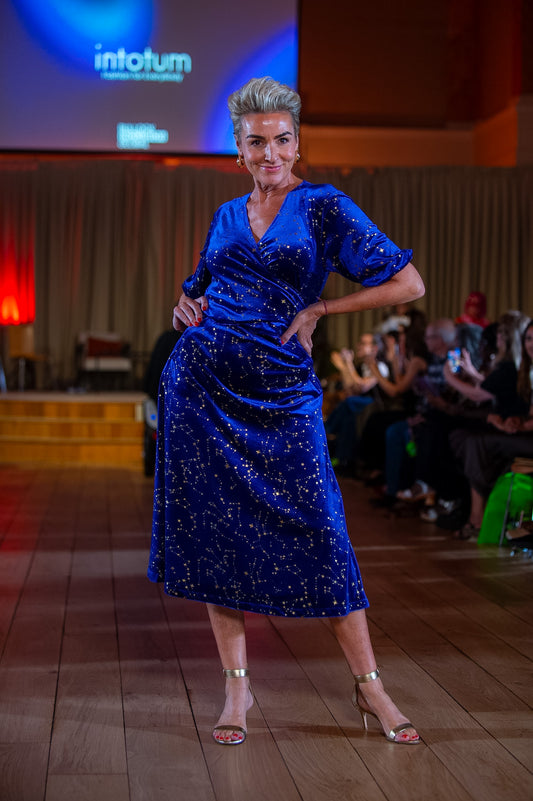 a woman in a blue dress